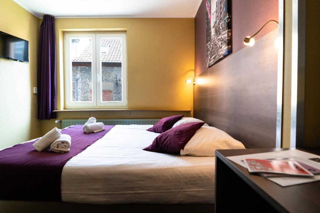 Postel nebo postele na pokoji v ubytování Flandria Hotel
