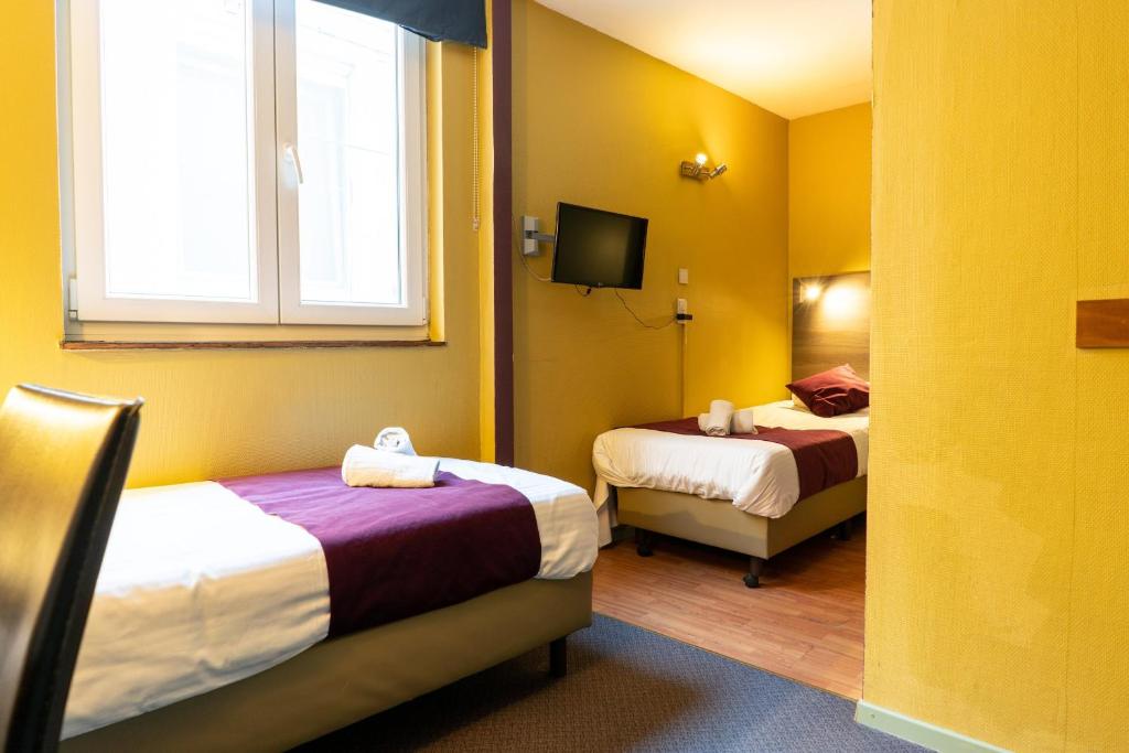 Postel nebo postele na pokoji v ubytování Flandria Hotel