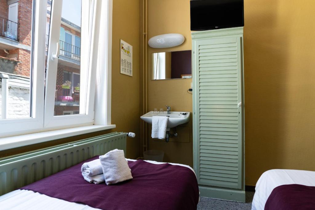 Postel nebo postele na pokoji v ubytování Flandria Hotel