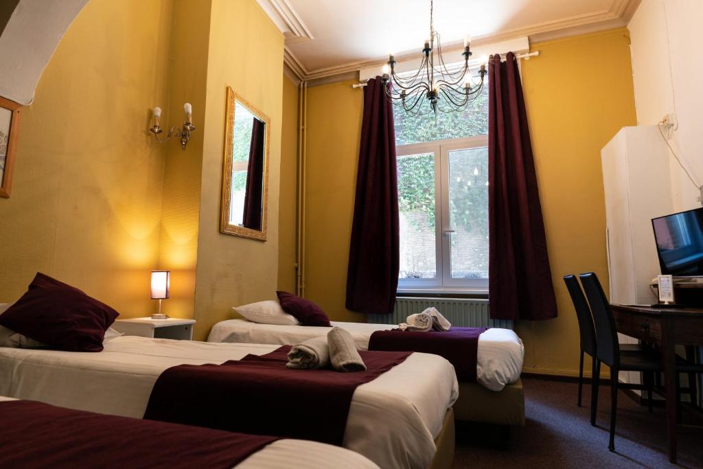 Postel nebo postele na pokoji v ubytování Flandria Hotel