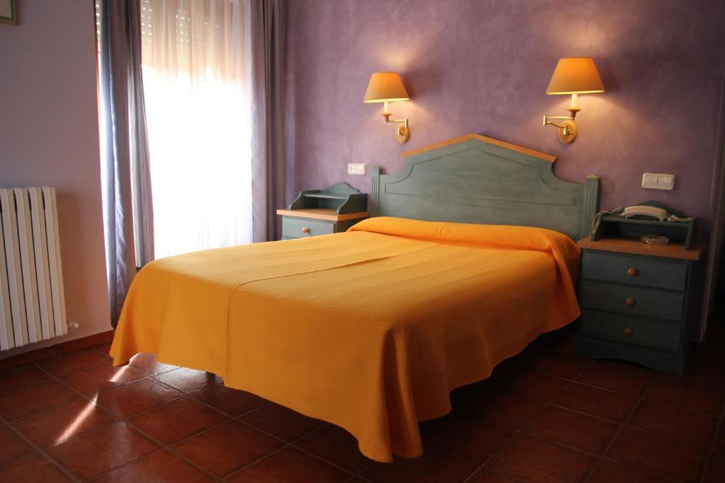 Postel nebo postele na pokoji v ubytování Hotel Fray Tomás