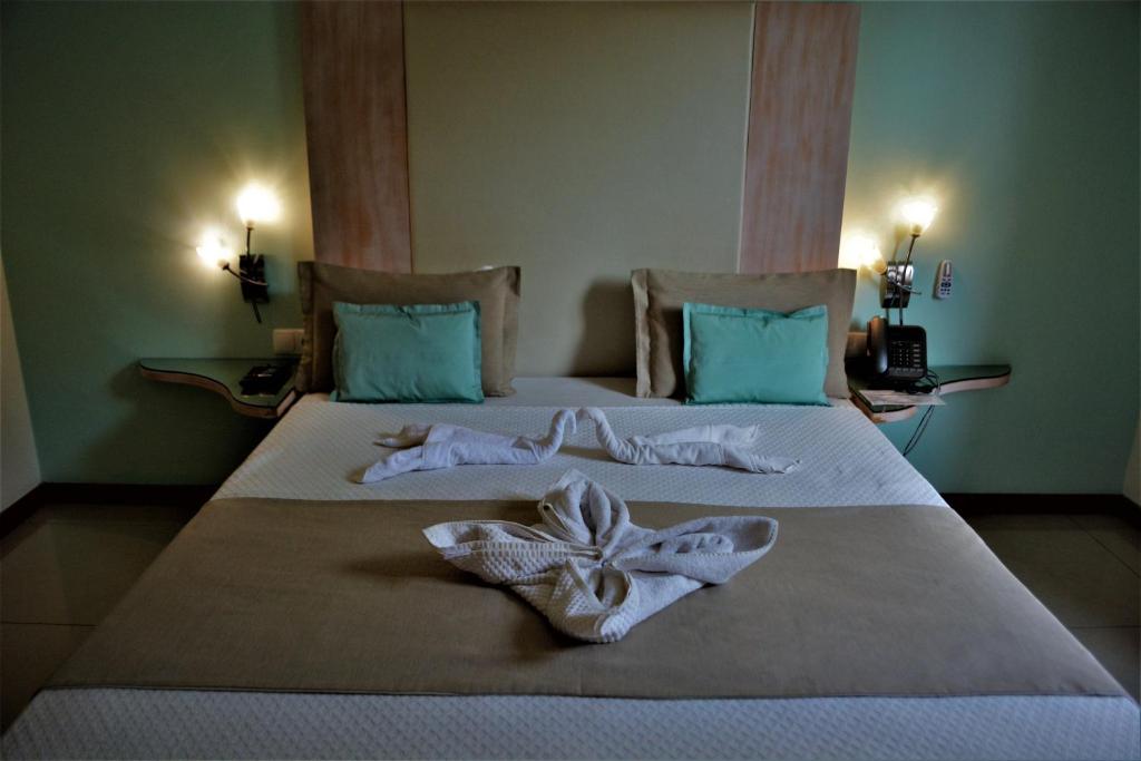 Postel nebo postele na pokoji v ubytování Sol Hotel