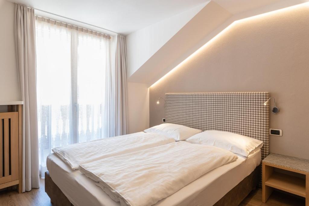 Postel nebo postele na pokoji v ubytování Villa Aurelia
