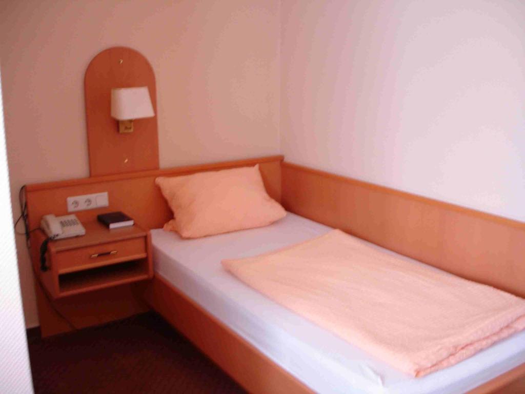 Postel nebo postele na pokoji v ubytování Hotel Bürgerhof