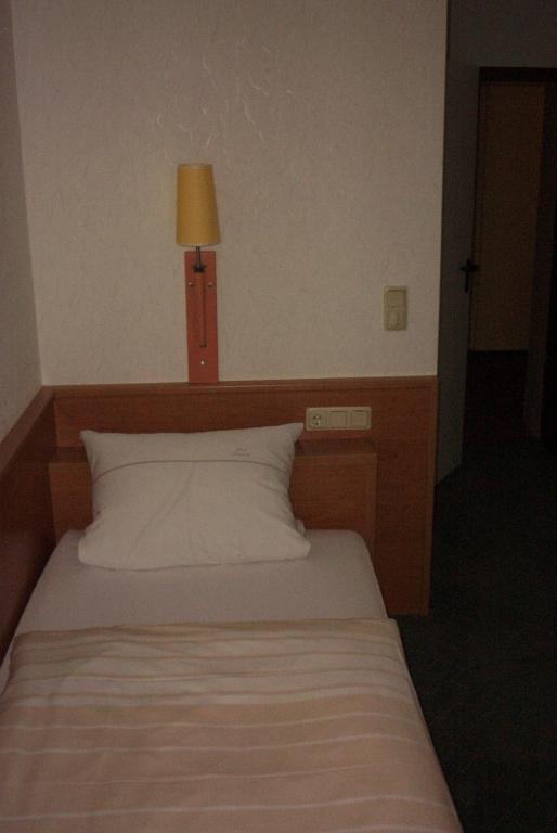 Postel nebo postele na pokoji v ubytování Hotel Bürgerhof