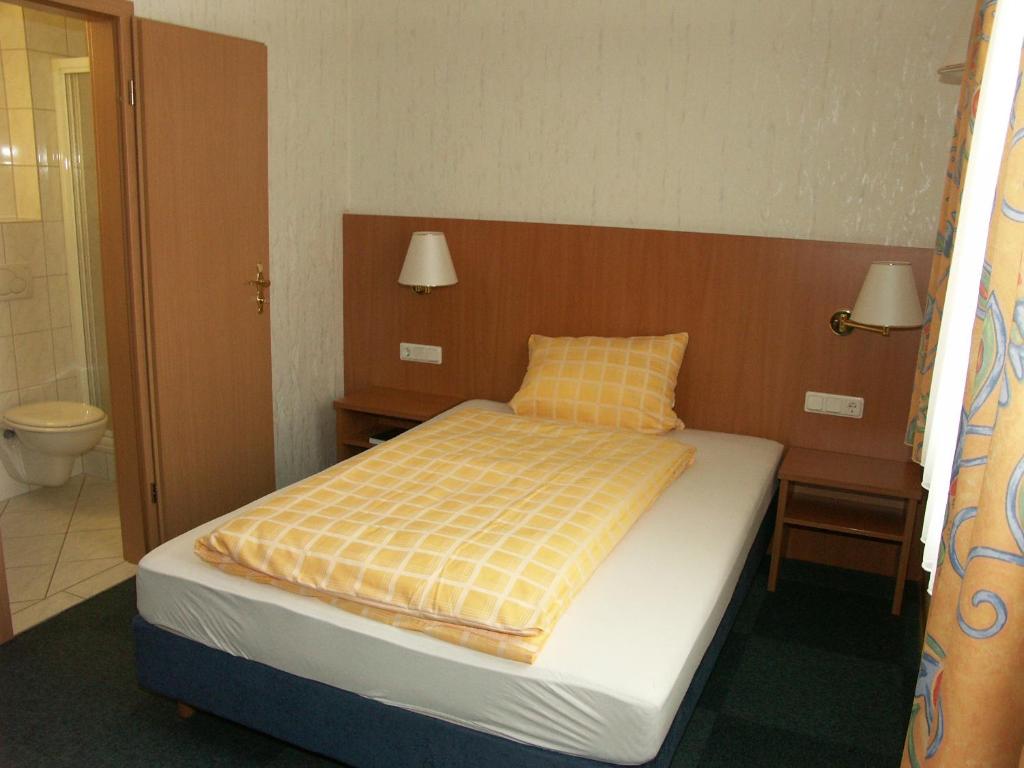 Postel nebo postele na pokoji v ubytování Hotel Bürgerhof