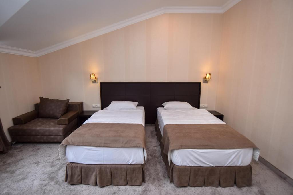 Postel nebo postele na pokoji v ubytování Laguna Hotel