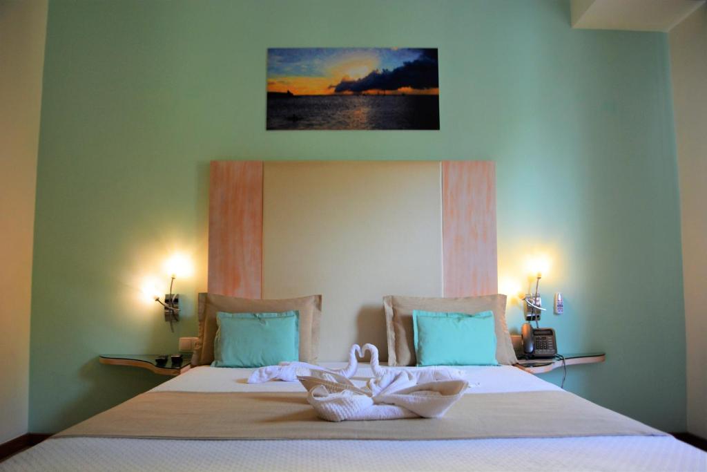 Postel nebo postele na pokoji v ubytování Sol Hotel