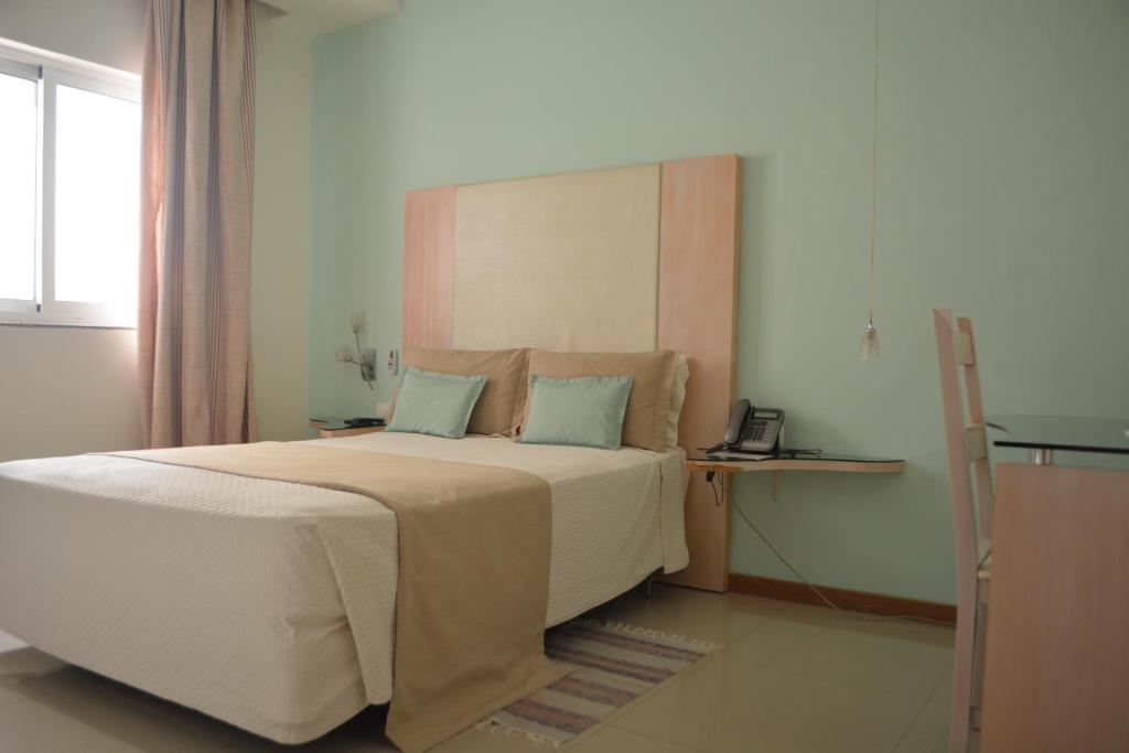 Postel nebo postele na pokoji v ubytování Sol Hotel