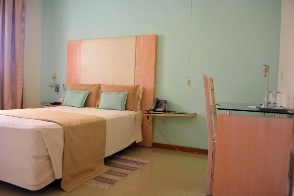 Postel nebo postele na pokoji v ubytování Sol Hotel