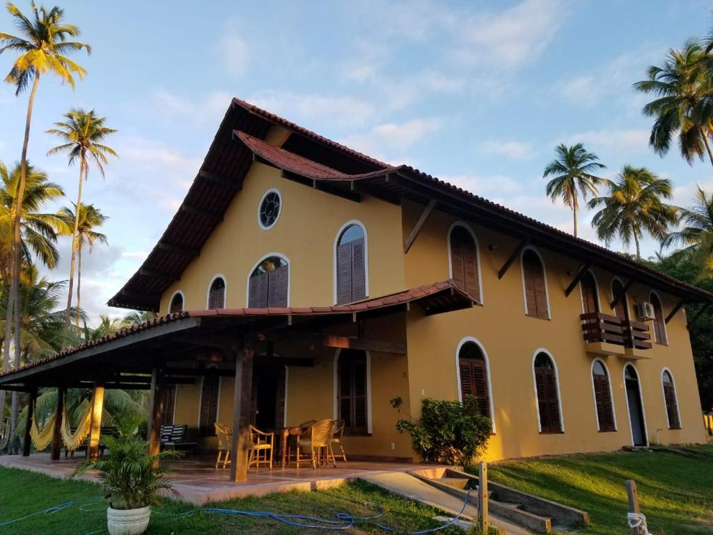 塔曼達雷的住宿－Pousada Igrejinha dos Carneiros，棕榈树度假屋