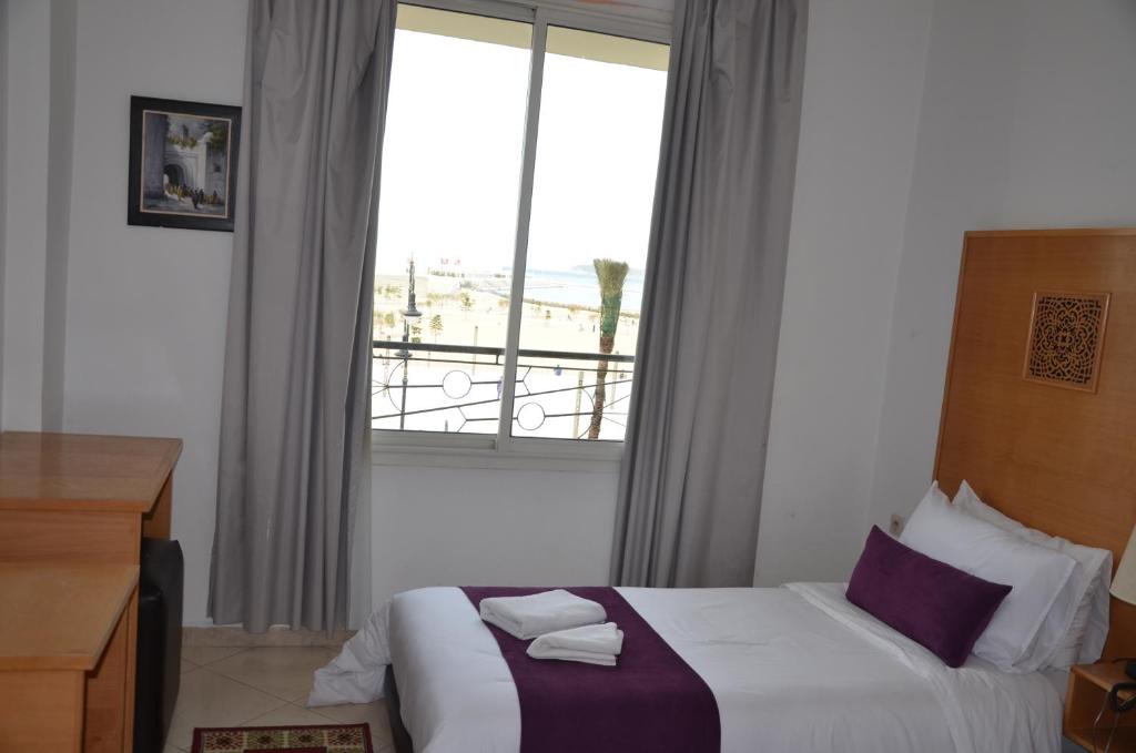 Postel nebo postele na pokoji v ubytování Hotel Miramar