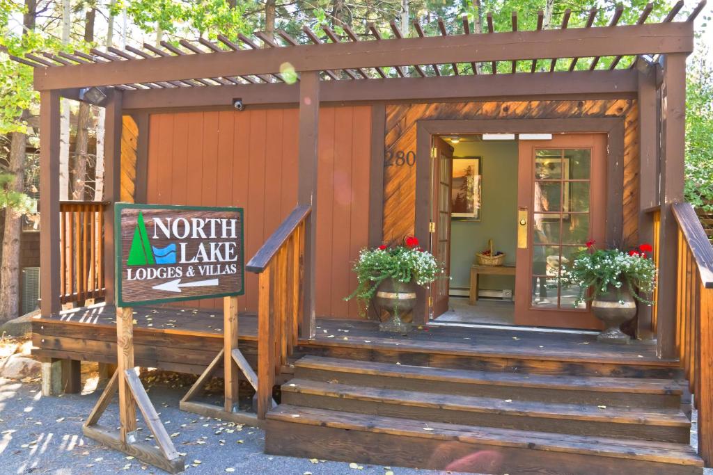 a tiny house with a sign in front of it at North Lake Lodges & Villas in Incline Village