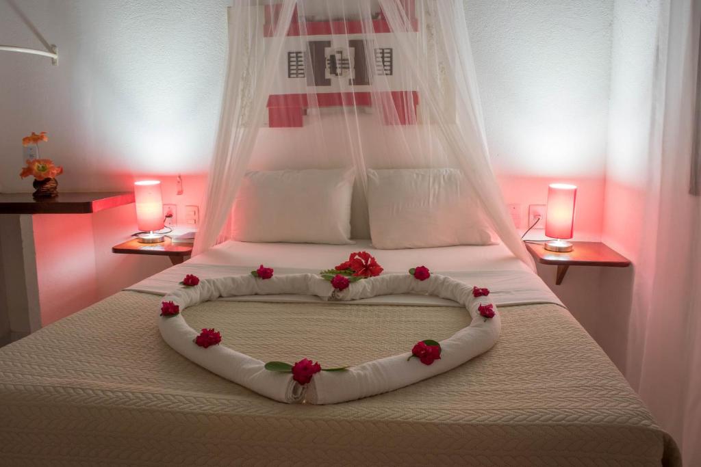 Cama ou camas em um quarto em Pousada Sol e Luna