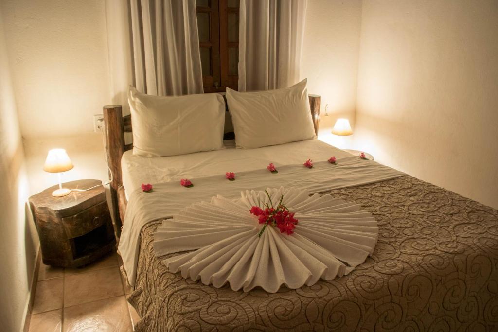 Cama ou camas em um quarto em Pousada Sol e Luna