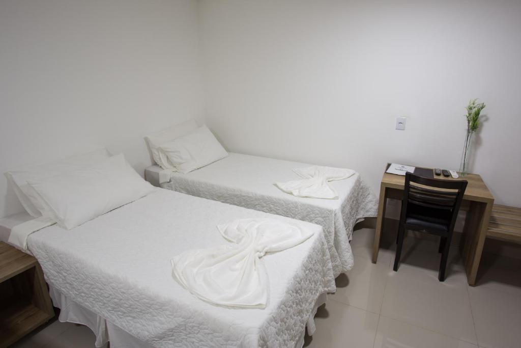 Postel nebo postele na pokoji v ubytování New Concept Hotel