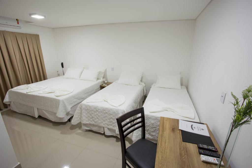 Postel nebo postele na pokoji v ubytování New Concept Hotel