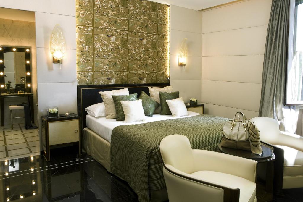 Łóżko lub łóżka w pokoju w obiekcie Baglioni Hotel Regina - The Leading Hotels of the World