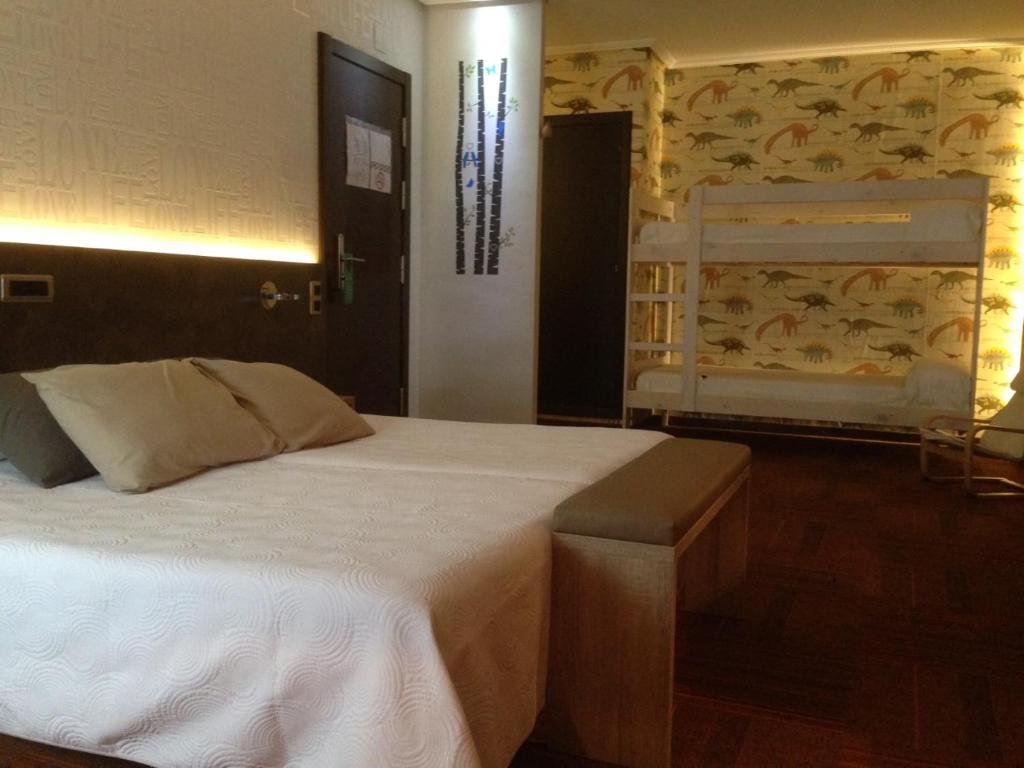 Postel nebo postele na pokoji v ubytování Hotel Oriente