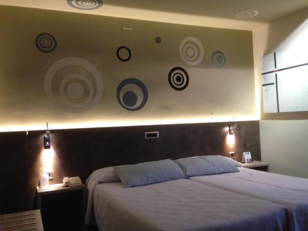 Postel nebo postele na pokoji v ubytování Hotel Oriente