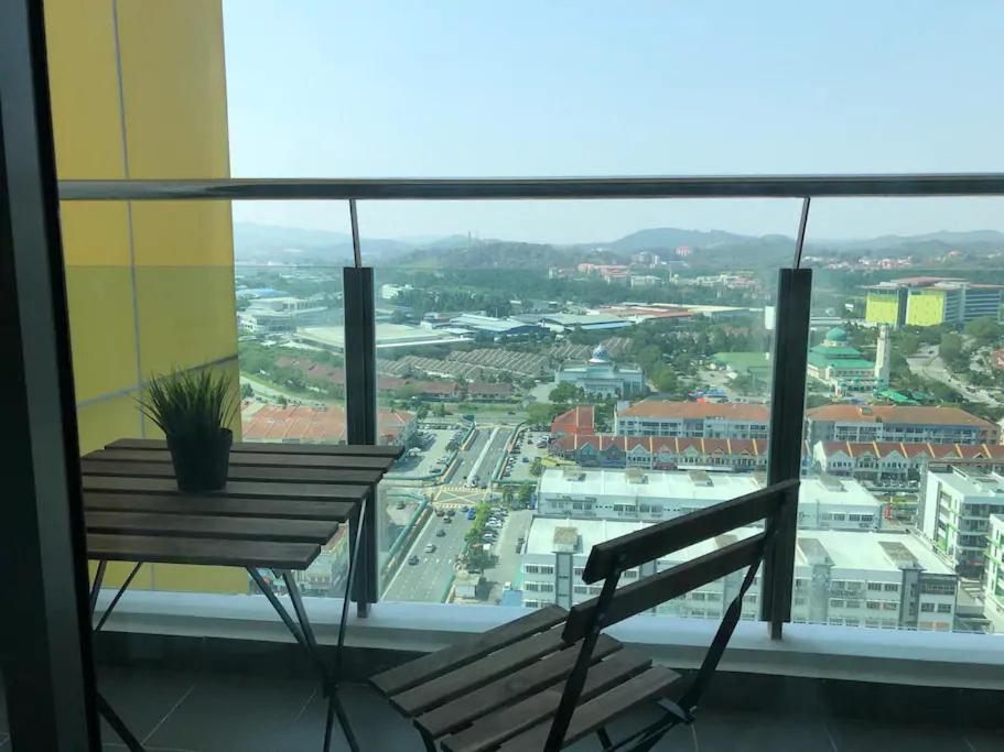 a balcony with a bench and a view of a city at Heart of Bandar Baru Bangi (2) in Bangi