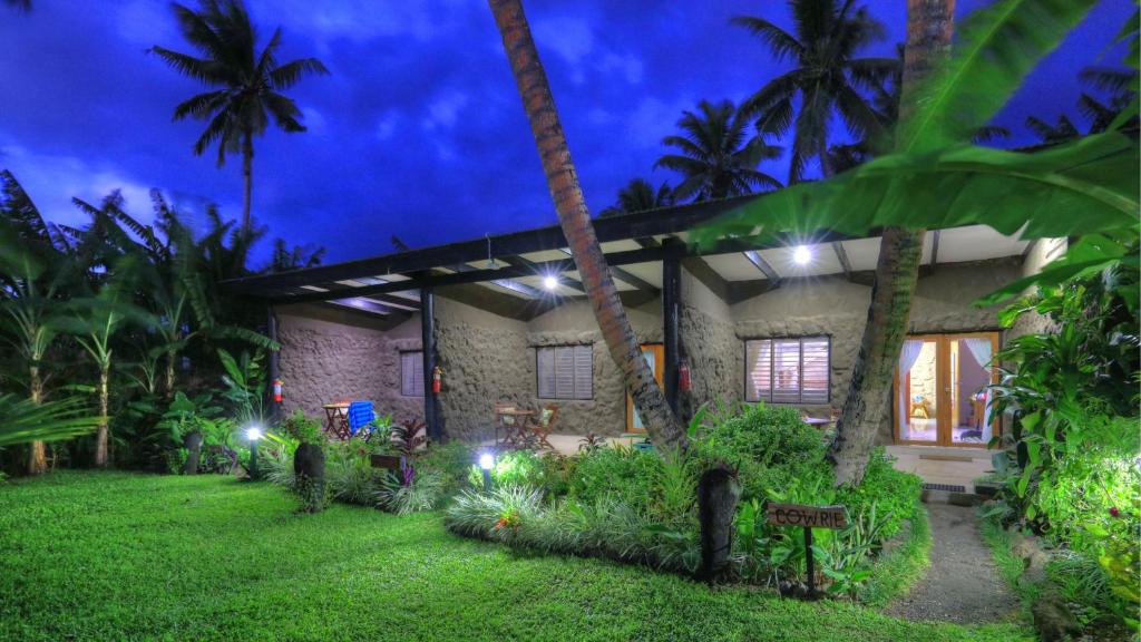 a house with a garden at night at Paradise Resort Taveuni in Waiyevo