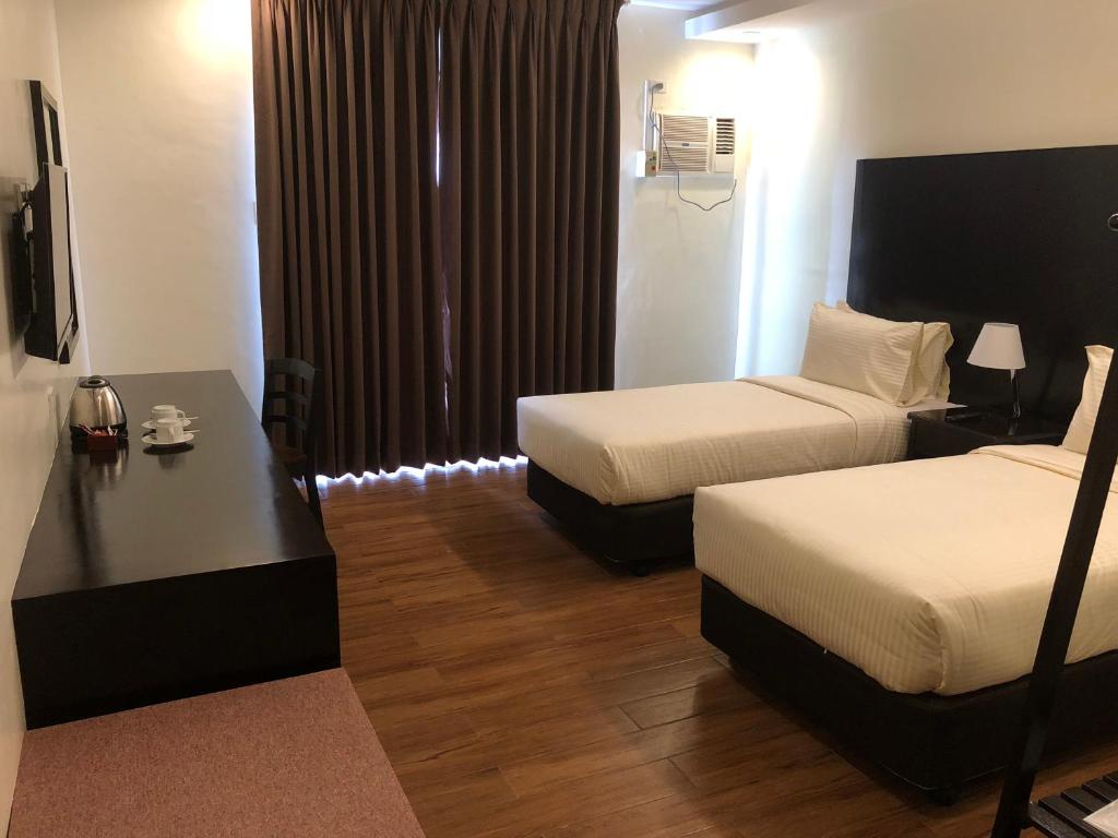 Postel nebo postele na pokoji v ubytování Piña Suites