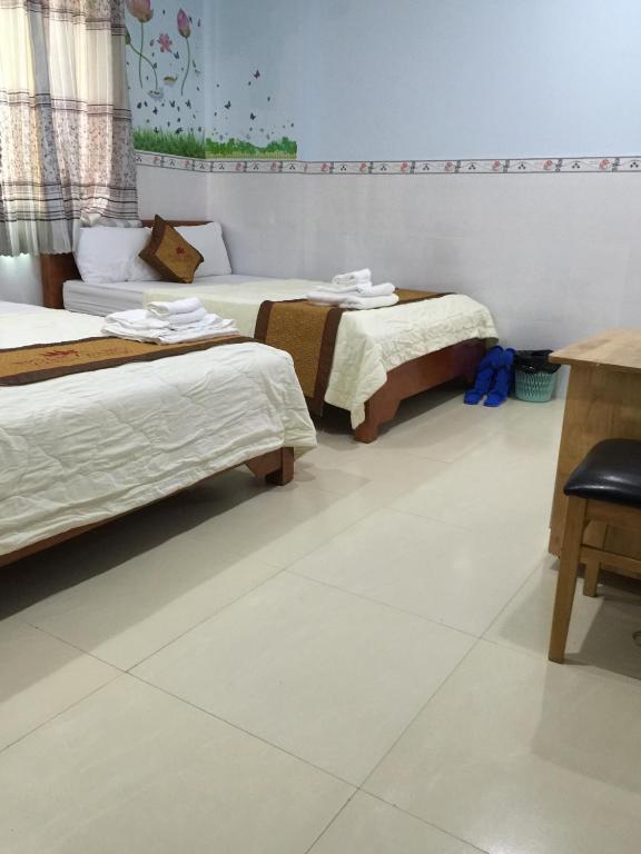 Postel nebo postele na pokoji v ubytování Ngan Giang Guesthouse