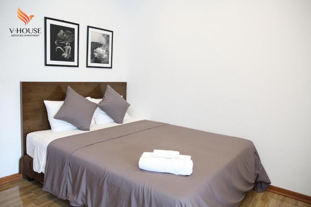 Postel nebo postele na pokoji v ubytování V House 5 Serviced Apartment