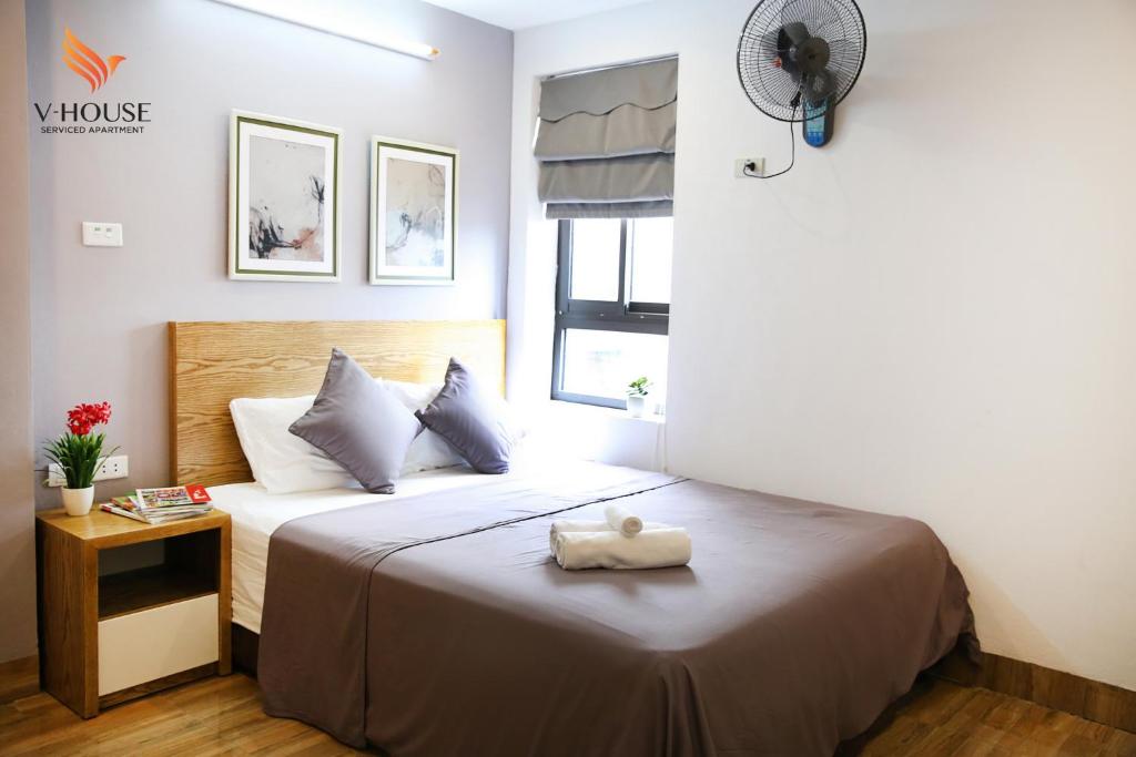Postel nebo postele na pokoji v ubytování V House 5 Serviced Apartment