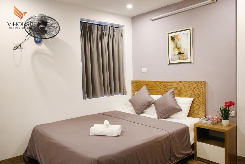 Postel nebo postele na pokoji v ubytování V House 5 Serviced Apartment