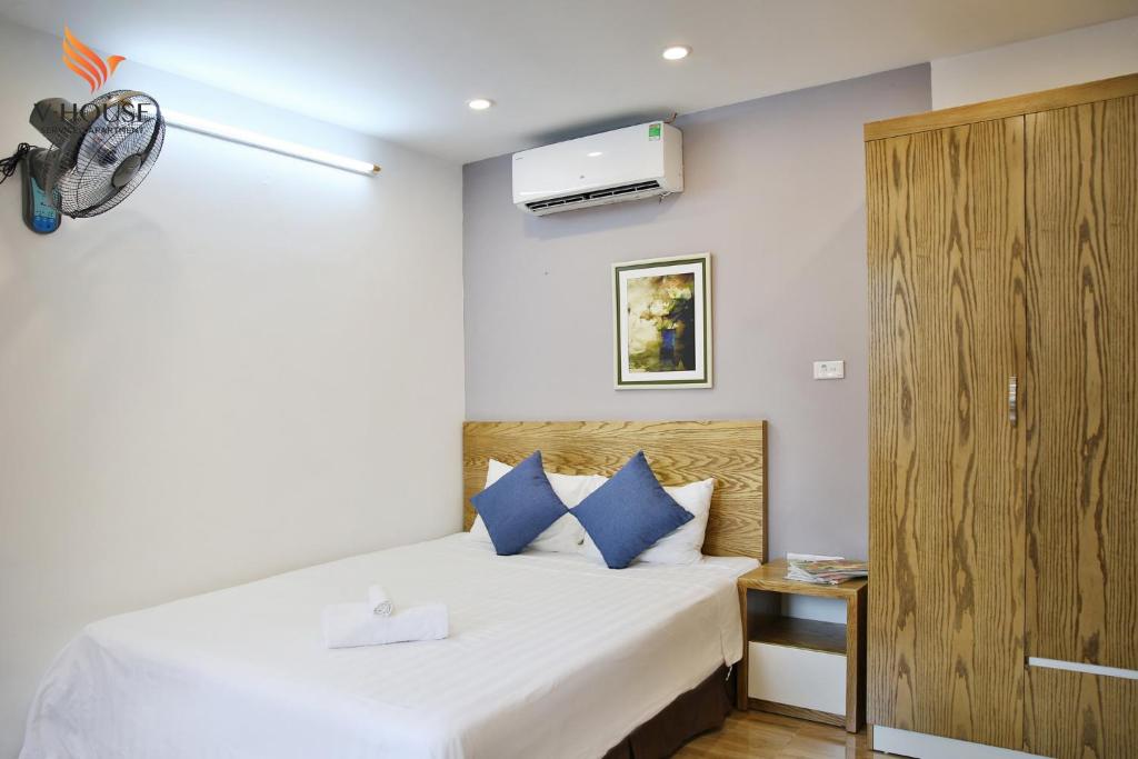 Postel nebo postele na pokoji v ubytování V House 5 Serviced Apartment
