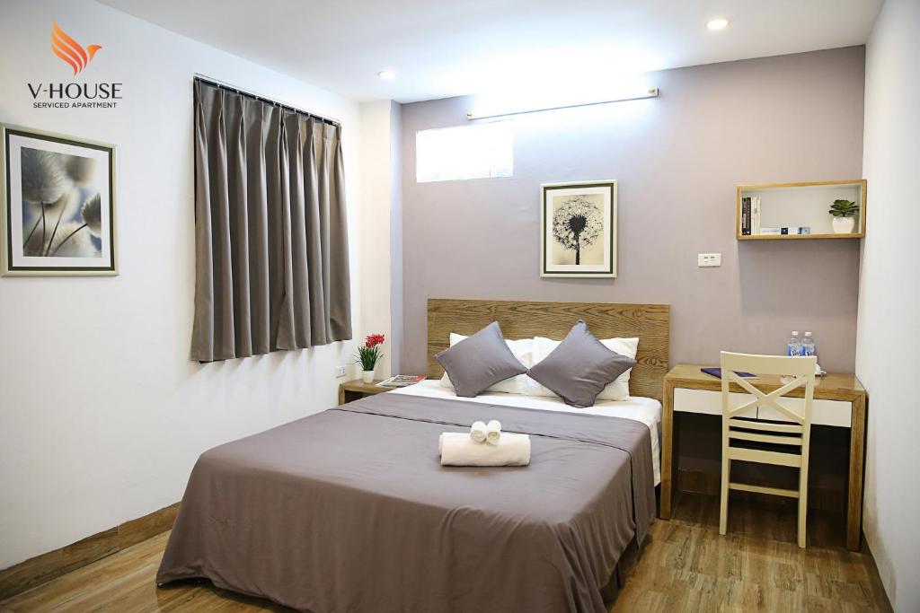 Postel nebo postele na pokoji v ubytování V House 5 Serviced Apartment