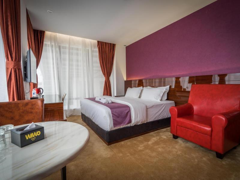 Postel nebo postele na pokoji v ubytování WIWO Hotel