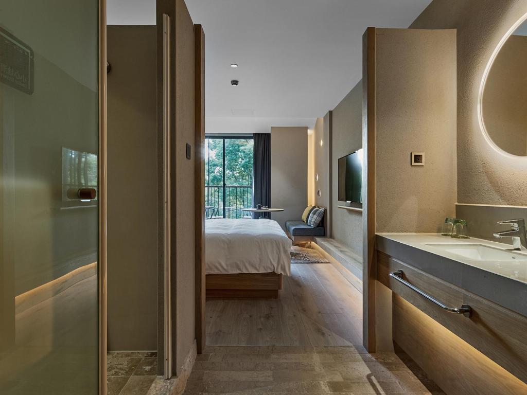 Voodi või voodid majutusasutuse EBO Hotel Hangzhou Wulin - 5 mins drive to the West Lake toas