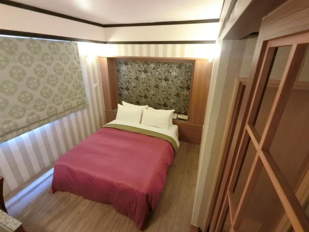 Postel nebo postele na pokoji v ubytování Nice Hotel