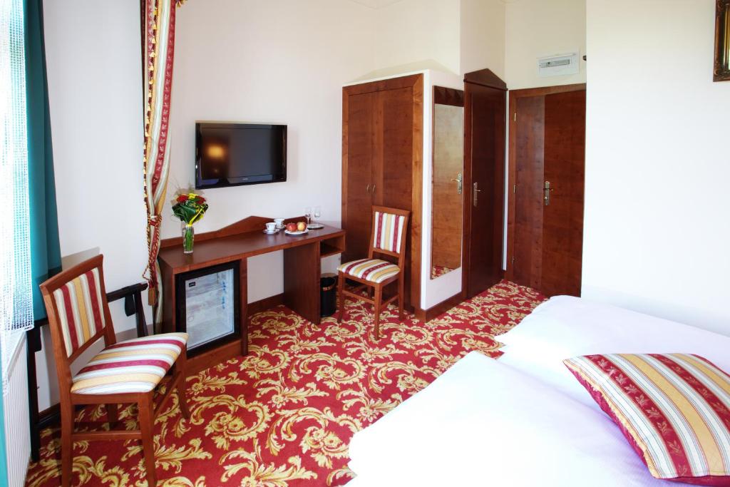 Postel nebo postele na pokoji v ubytování Hotel Fortna