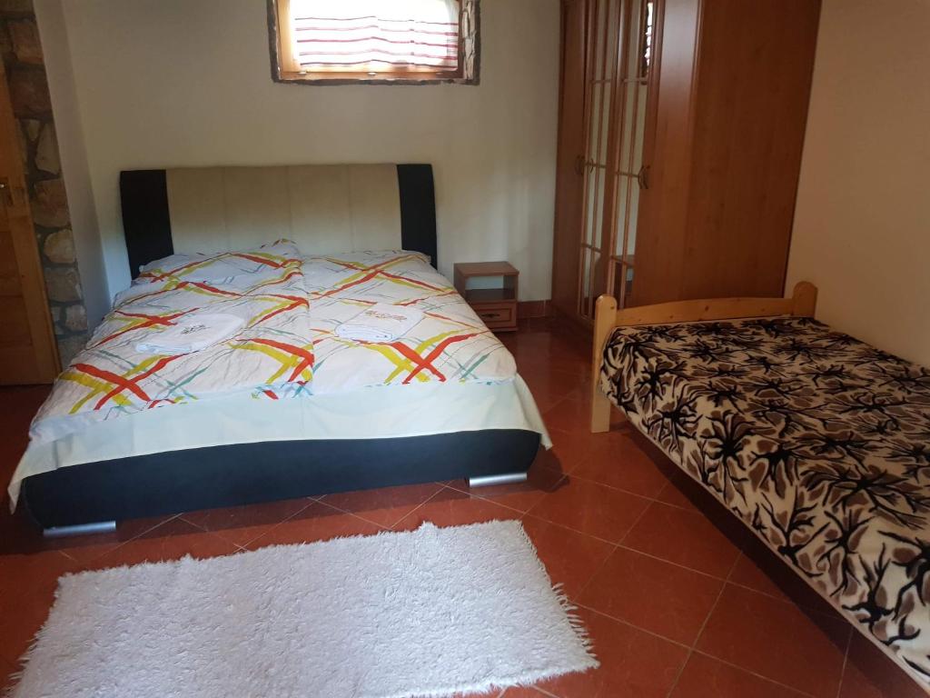 Postel nebo postele na pokoji v ubytování Cserhát Guesthouse