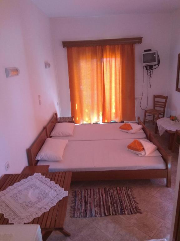 Postel nebo postele na pokoji v ubytování Panorama Palaiοpolis