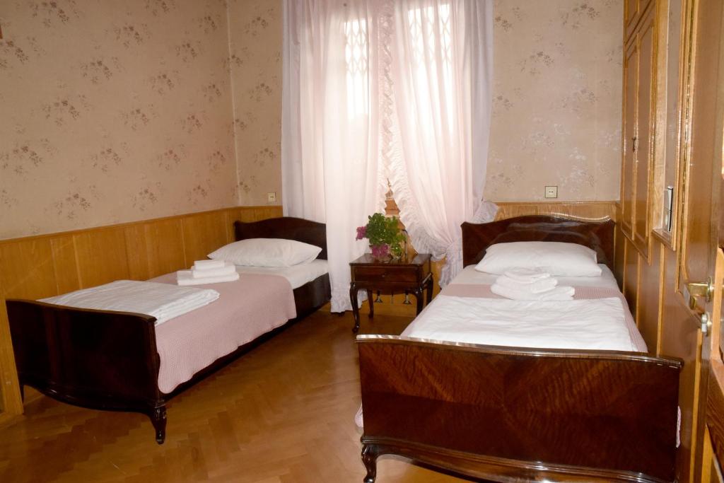 Postel nebo postele na pokoji v ubytování Guest House Kartuli Suli