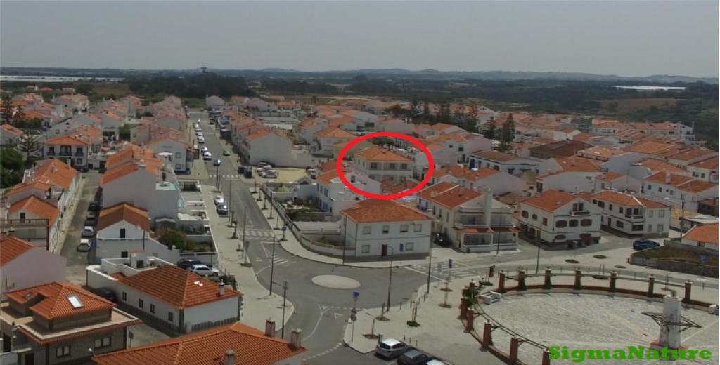 a red circle on top of a city at Hostel Nature in Zambujeira do Mar