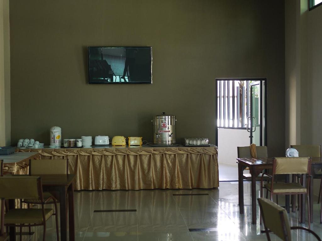 TV a/nebo společenská místnost v ubytování Pimann Place Hotel