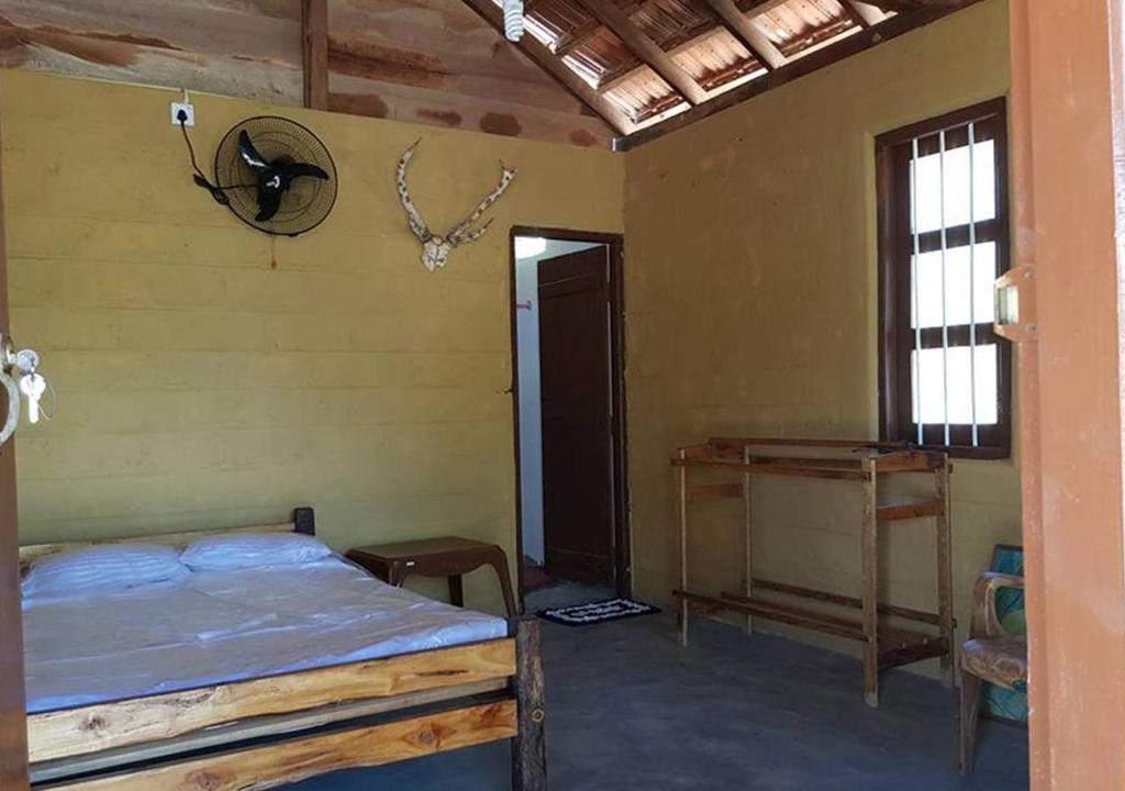 Postel nebo postele na pokoji v ubytování Ganesh Gate