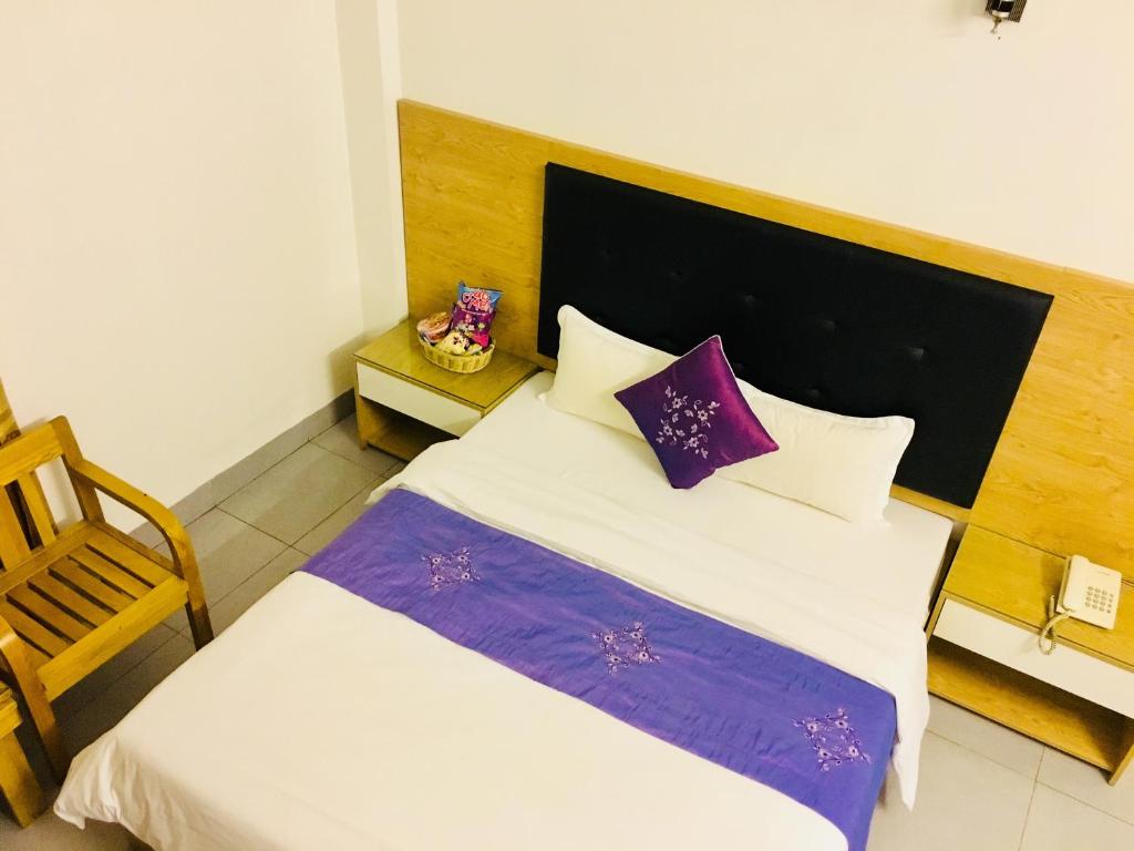 Postel nebo postele na pokoji v ubytování Hotel Hoang Gia