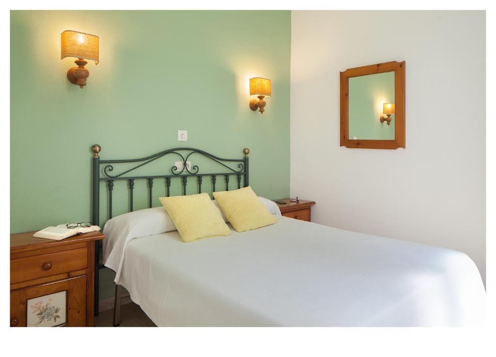 Postel nebo postele na pokoji v ubytování Hotel Ninays