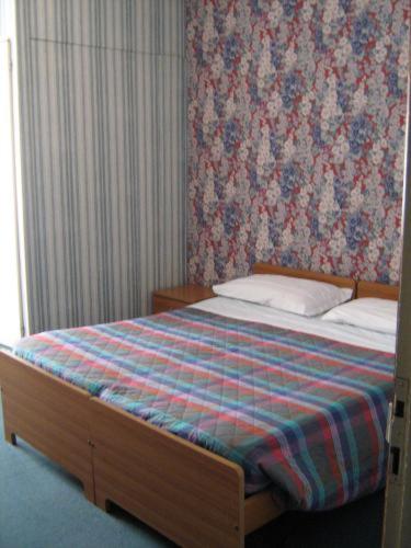 Postel nebo postele na pokoji v ubytování Hotel Da Cesare
