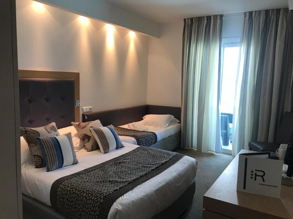 Postel nebo postele na pokoji v ubytování Hotel Revellata & Spa