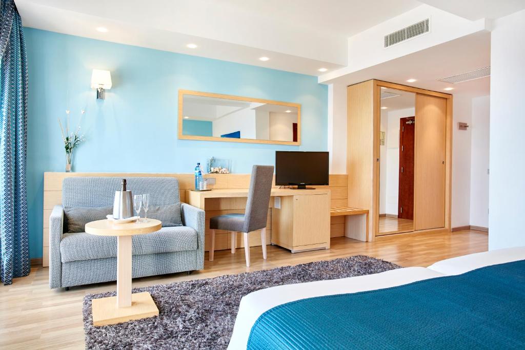 TV a/nebo společenská místnost v ubytování Universal Hotel Cabo Blanco - Adults Only
