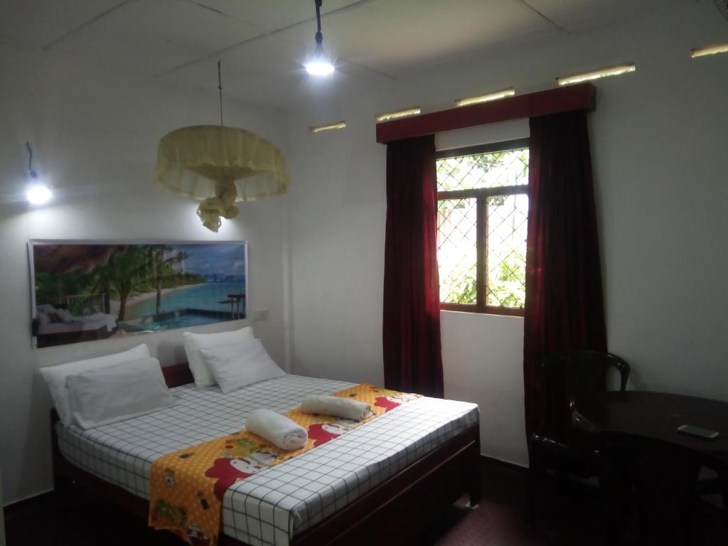 Postel nebo postele na pokoji v ubytování Erandi Holiday Home