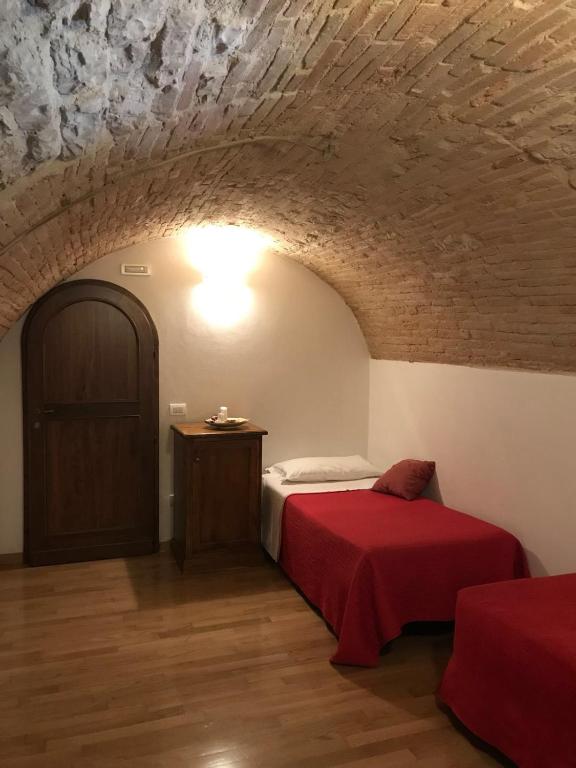 Postel nebo postele na pokoji v ubytování Residenza Via Dante